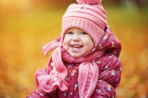 happy baby girl child outdoors in the park in autumn